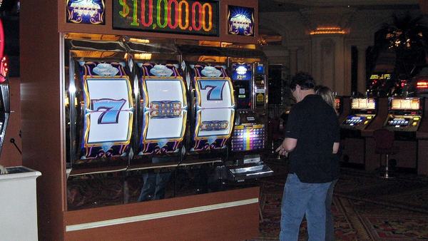 Player at a row of slot machines