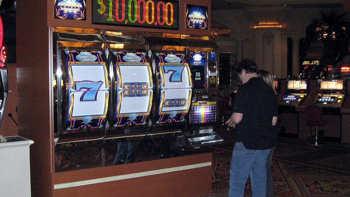 Player at a row of slot machines